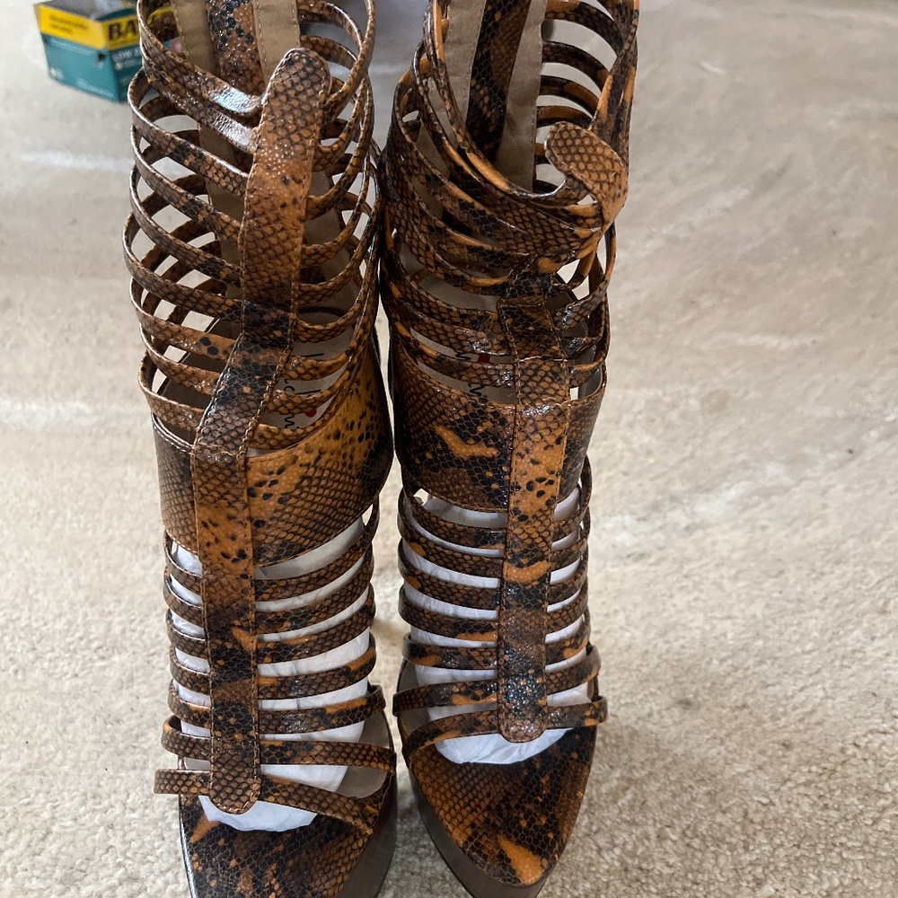 snake skin heels never worn All sales are finial